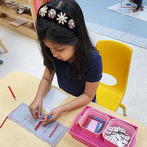 Girl playing pencil