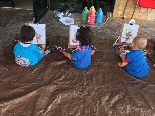 Three toddler painting