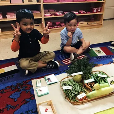 Two small kids posing for camera